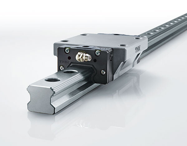 A product image of the Super-Low Waving LM Guide Model SPH with ISO-Compliant Dimensions. The rail has eight grooves for the rolling elements to travel along.