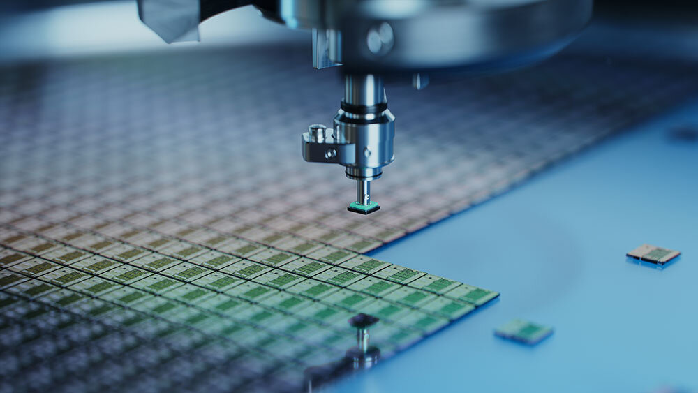 A robot picking semiconductor chips from a silicon wafer